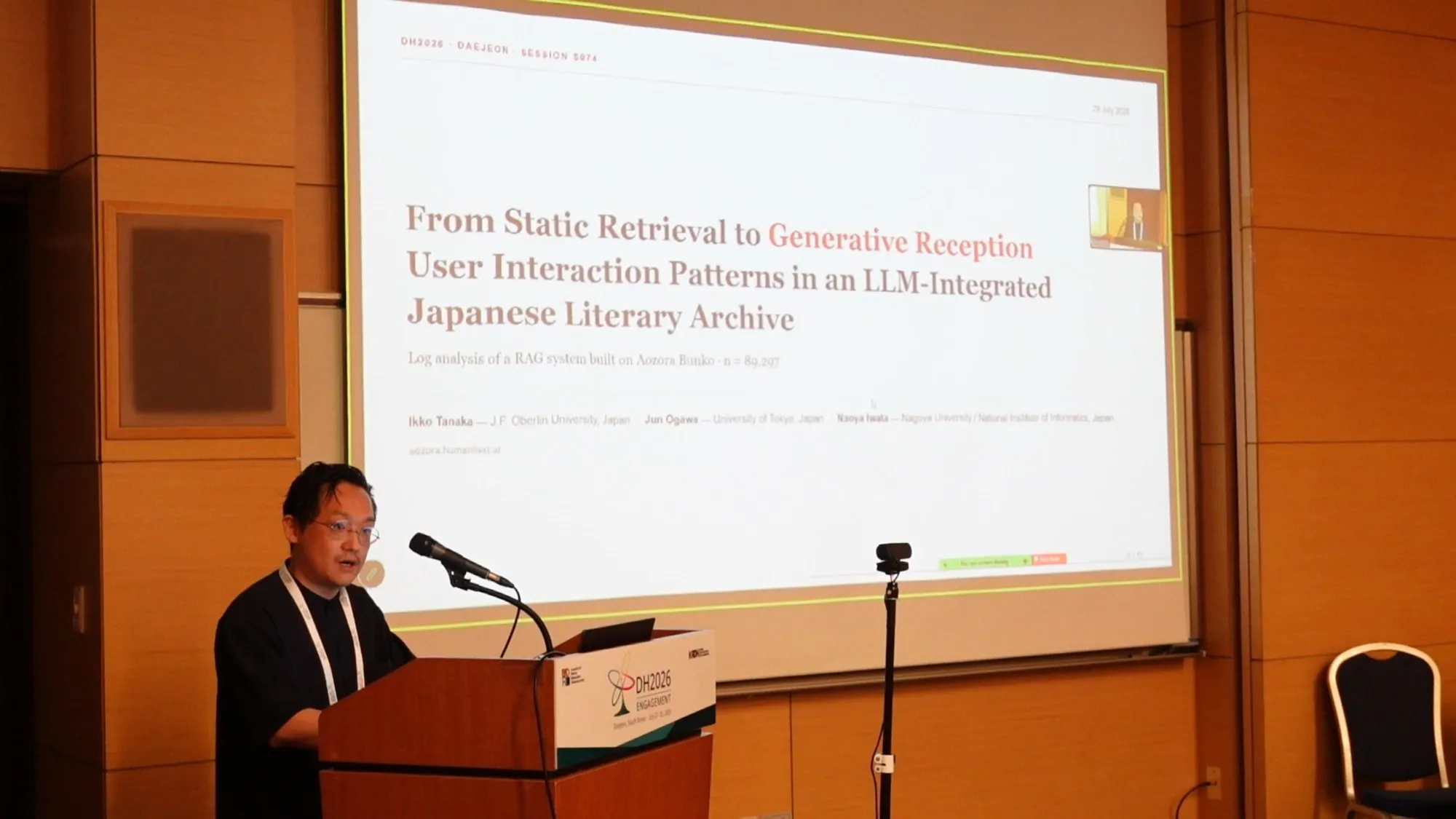 Ikko Tanaka presenting at DH2026 with the title slide “From Static Retrieval to Generative Reception”