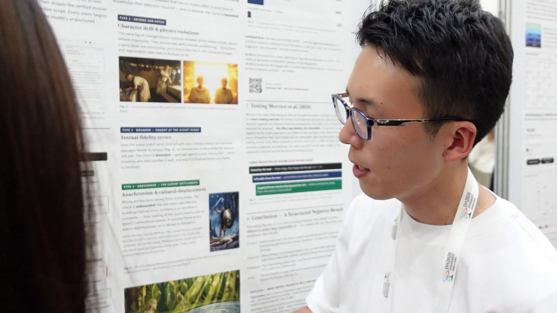 Explaining the video-synthesis framework to a visitor at the DH2026 poster session